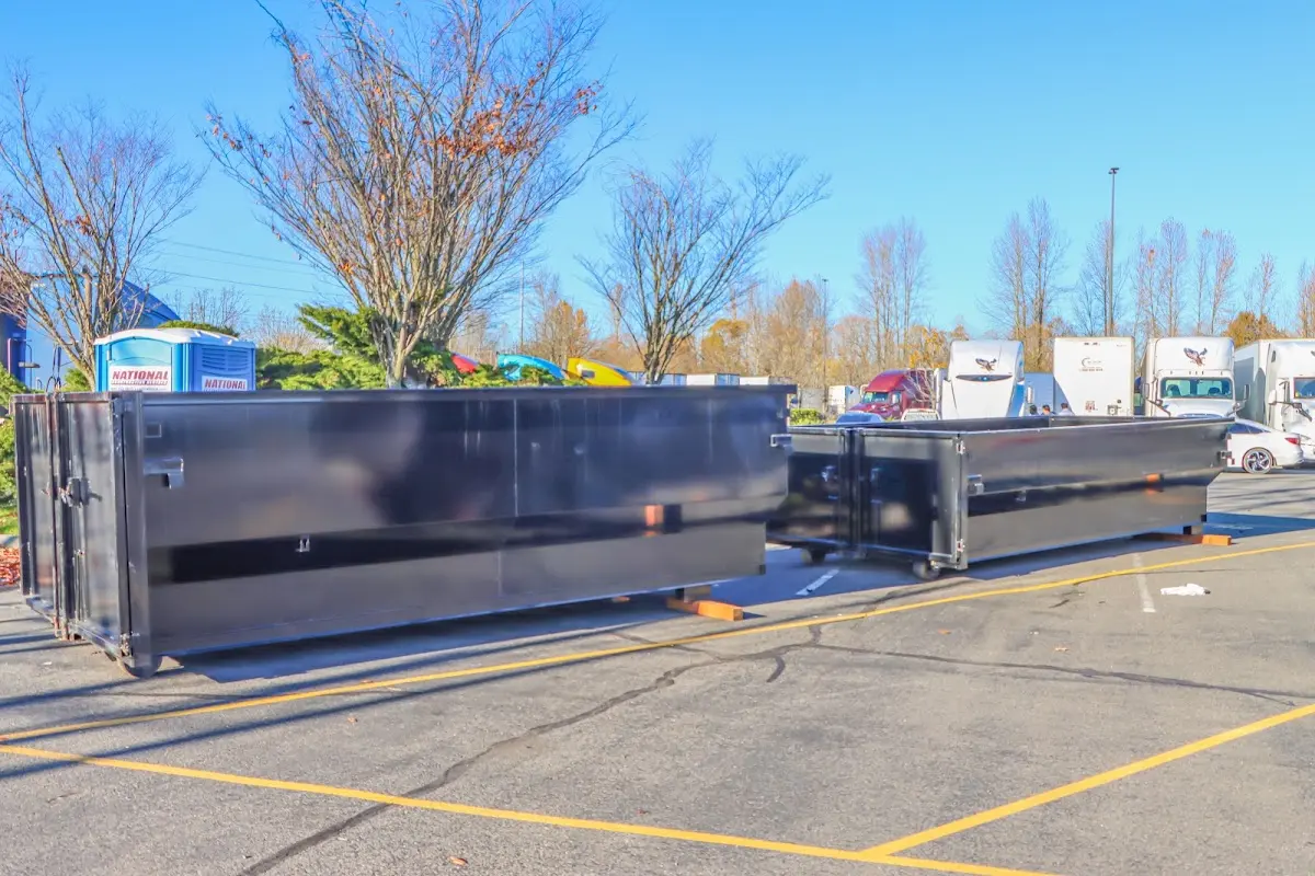 Professional dumpster rental service with roll-off container on residential driveway in Wright City